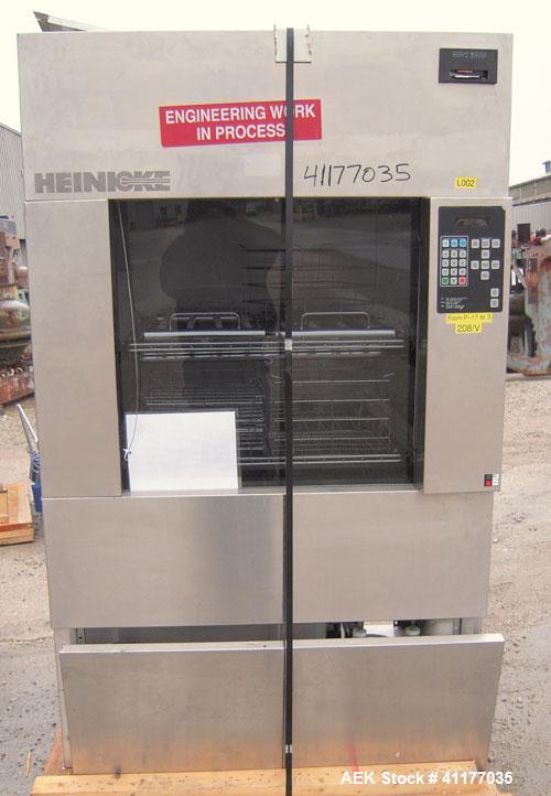 Used Heinicke/Hotpack Floor Glassware Washer, Model H-4100E. 316L stainless steel chamber, 29" wide x 27" deep x 26" high. Power vertical tempered glass door, 8 basket design, 304 stainless steel ext...