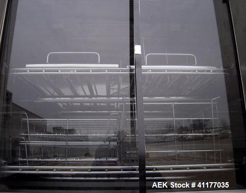 Used Heinicke/Hotpack Floor Glassware Washer, Model H-4100E. 316L stainless steel chamber, 29" wide x 27" deep x 26" high. Power vertical tempered glass door, 8 basket design, 304 stainless steel ext...