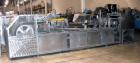 Used Bevco High Speed Bottle Washer, all stainless steel. Approximately 24' long, adjustable, with motor drives and electronics, approximately 5 hp, 230 volt. Serial #J1969. Machine footprint 276