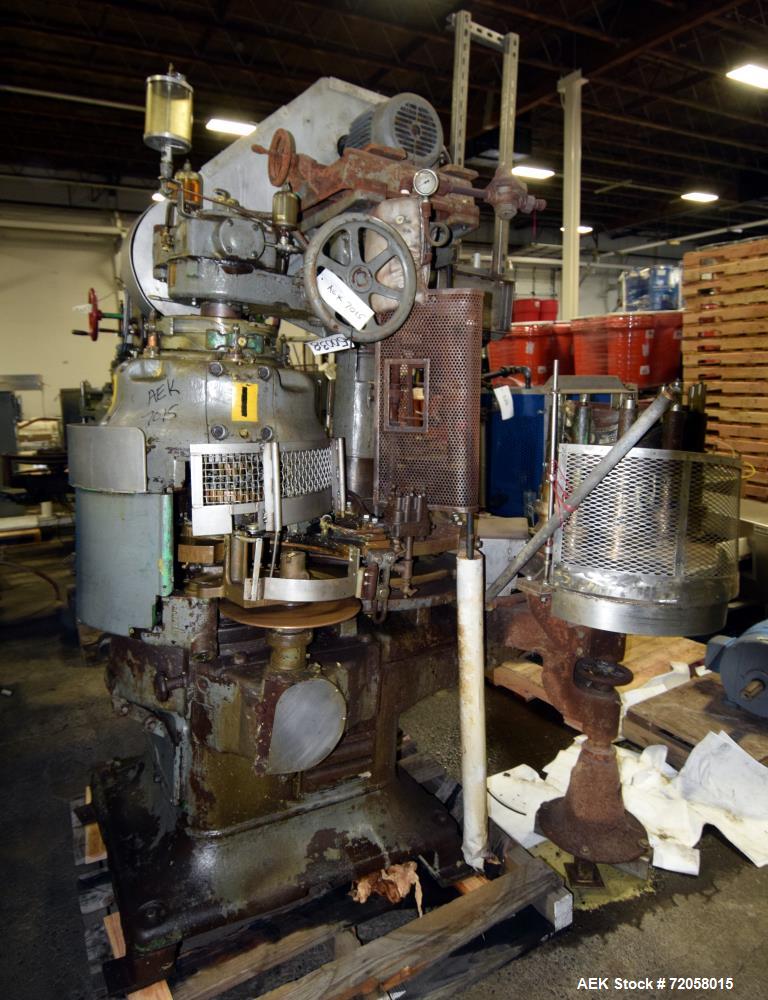 Used American Can (4) Head Can Closing Machine, Model 458-4DS. Set up for 300x407 cans, disc infeed with spring loaded topper, turret & outer rail steam flow, 211-307 seaming heads, disc discharge.