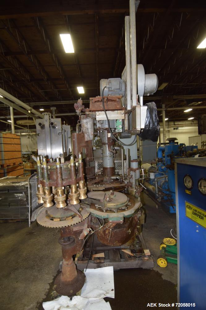 Used American Can (4) Head Can Closing Machine, Model 458-4DS. Set up for 300x407 cans, disc infeed with spring loaded topper, turret & outer rail steam flow, 211-307 seaming heads, disc discharge.