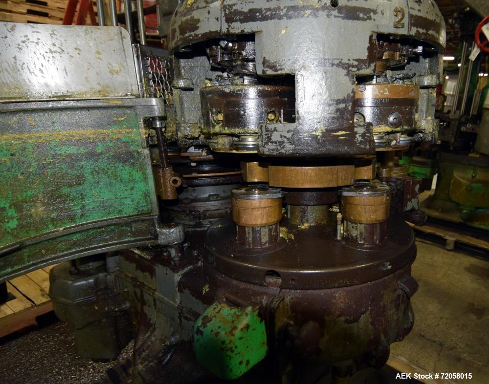 Used American Can (4) Head Can Closing Machine, Model 458-4DS. Set up for 300x407 cans, disc infeed with spring loaded topper, turret & outer rail steam flow, 211-307 seaming heads, disc discharge.