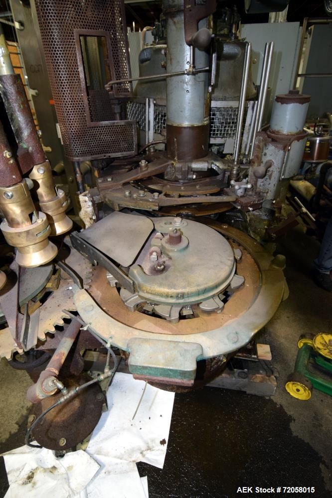 Used American Can (4) Head Can Closing Machine, Model 458-4DS. Set up for 300x407 cans, disc infeed with spring loaded topper, turret & outer rail steam flow, 211-307 seaming heads, disc discharge.