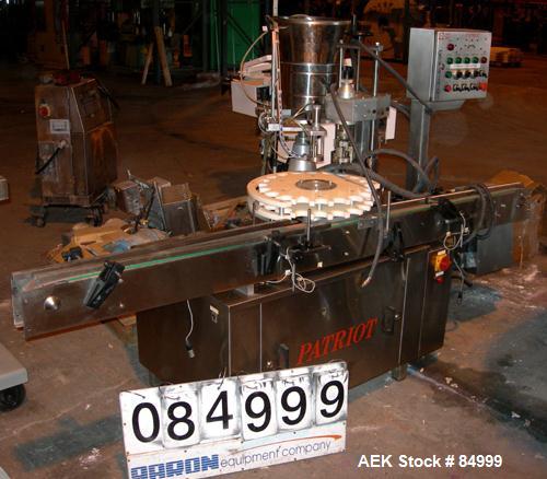 USED: Capmatic vial capper/crimper, model Patriot A10. Last doing approx 13/16" diameter caps. Includes a feed hopper, cap chute, crimping head, control panel and a 3-1/2" wide x 94" long feed/take a...