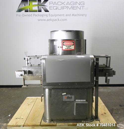 Used Nalbach Model 8 H.V.C. 8-Head Rotary Cap Crimper. Machine is capable of speeds up to 240 caps per minute. Is an 8-head crimper currently set on 25mm caps. Has worm screw to star wheel infeed. Ro...