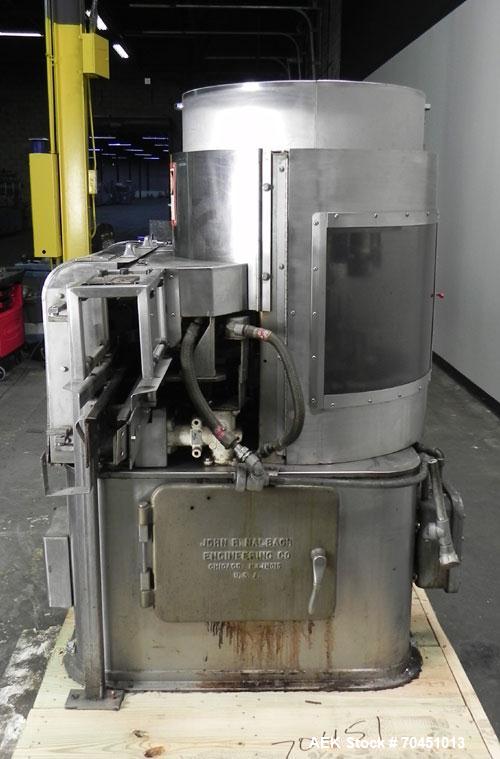 Used Nalbach Model 8 H.V.C. 8-Head Rotary Cap Crimper. Machine is capable of speeds up to 240 caps per minute. Is an 8-head crimper currently set on 25mm caps. Has worm screw to star wheel infeed. Ro...