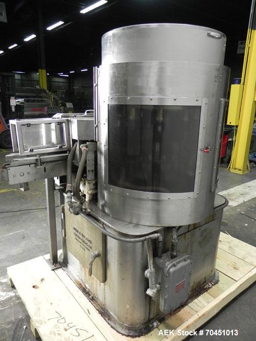 Used Nalbach Model 8 H.V.C. 8-Head Rotary Cap Crimper. Machine is capable of speeds up to 240 caps per minute. Is an 8-head crimper currently set on 25mm caps. Has worm screw to star wheel infeed. Ro...