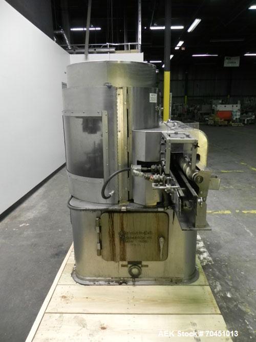 Used Nalbach Model 8 H.V.C. 8-Head Rotary Cap Crimper. Machine is capable of speeds up to 240 caps per minute. Is an 8-head crimper currently set on 25mm caps. Has worm screw to star wheel infeed. Ro...