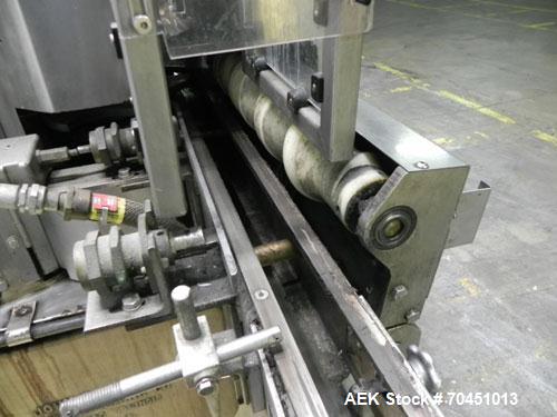 Used Nalbach Model 8 H.V.C. 8-Head Rotary Cap Crimper. Machine is capable of speeds up to 240 caps per minute. Is an 8-head crimper currently set on 25mm caps. Has worm screw to star wheel infeed. Ro...