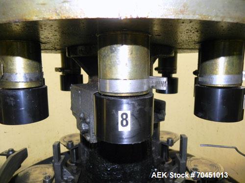 Used Nalbach Model 8 H.V.C. 8-Head Rotary Cap Crimper. Machine is capable of speeds up to 240 caps per minute. Is an 8-head crimper currently set on 25mm caps. Has worm screw to star wheel infeed. Ro...