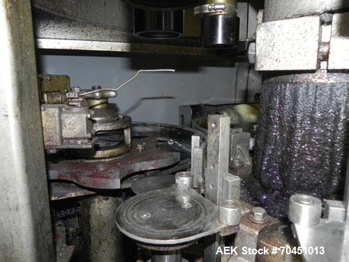 Used Nalbach Model 8 H.V.C. 8-Head Rotary Cap Crimper. Machine is capable of speeds up to 240 caps per minute. Is an 8-head crimper currently set on 25mm caps. Has worm screw to star wheel infeed. Ro...