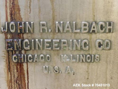 Used Nalbach Model 8 H.V.C. 8-Head Rotary Cap Crimper. Machine is capable of speeds up to 240 caps per minute. Is an 8-head crimper currently set on 25mm caps. Has worm screw to star wheel infeed. Ro...