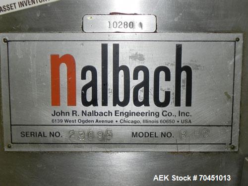 Used Nalbach Model 8 H.V.C. 8-Head Rotary Cap Crimper. Machine is capable of speeds up to 240 caps per minute. Is an 8-head crimper currently set on 25mm caps. Has worm screw to star wheel infeed. Ro...