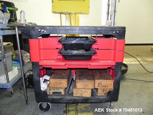 Used Nalbach Model 8 H.V.C. 8-Head Rotary Cap Crimper. Machine is capable of speeds up to 240 caps per minute. Is an 8-head crimper currently set on 25mm caps. Has worm screw to star wheel infeed. Ro...