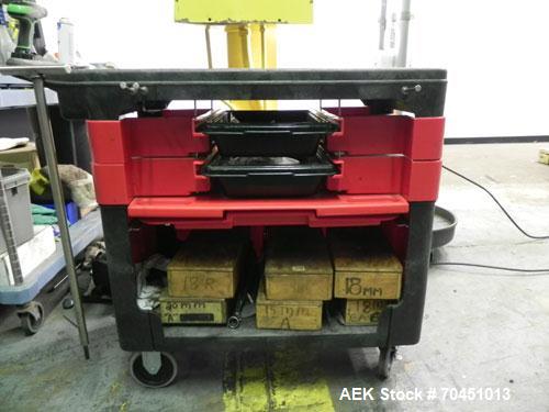 Used Nalbach Model 8 H.V.C. 8-Head Rotary Cap Crimper. Machine is capable of speeds up to 240 caps per minute. Is an 8-head crimper currently set on 25mm caps. Has worm screw to star wheel infeed. Ro...