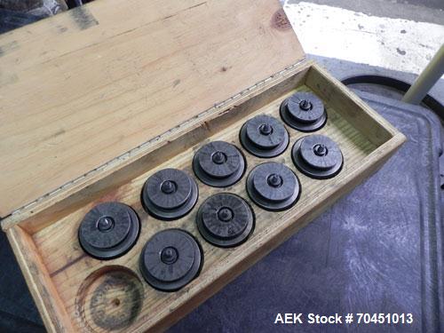 Used Nalbach Model 8 H.V.C. 8-Head Rotary Cap Crimper. Machine is capable of speeds up to 240 caps per minute. Is an 8-head crimper currently set on 25mm caps. Has worm screw to star wheel infeed. Ro...
