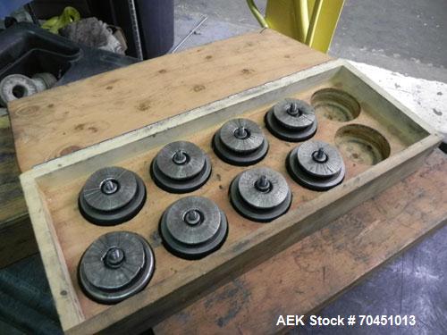 Used Nalbach Model 8 H.V.C. 8-Head Rotary Cap Crimper. Machine is capable of speeds up to 240 caps per minute. Is an 8-head crimper currently set on 25mm caps. Has worm screw to star wheel infeed. Ro...