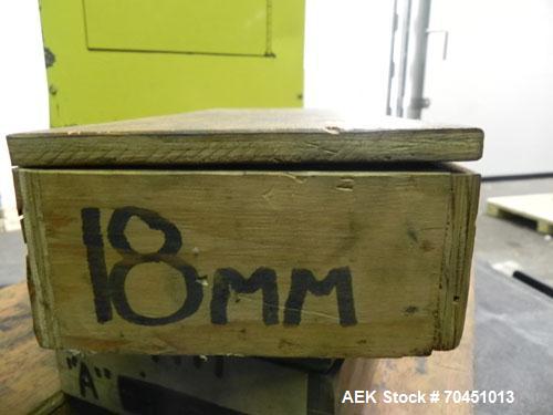 Used Nalbach Model 8 H.V.C. 8-Head Rotary Cap Crimper. Machine is capable of speeds up to 240 caps per minute. Is an 8-head crimper currently set on 25mm caps. Has worm screw to star wheel infeed. Ro...
