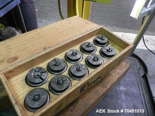 Used Nalbach Model 8 H.V.C. 8-Head Rotary Cap Crimper. Machine is capable of speeds up to 240 caps per minute. Is an 8-head crimper currently set on 25mm caps. Has worm screw to star wheel infeed. Ro...