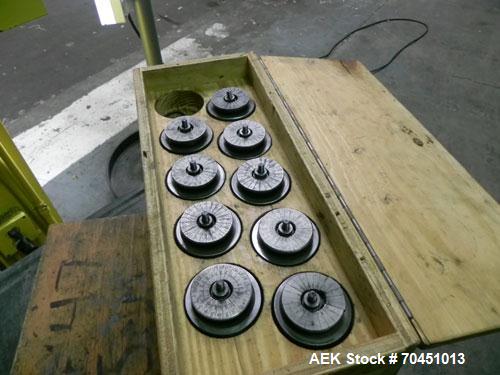 Used Nalbach Model 8 H.V.C. 8-Head Rotary Cap Crimper. Machine is capable of speeds up to 240 caps per minute. Is an 8-head crimper currently set on 25mm caps. Has worm screw to star wheel infeed. Ro...