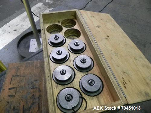 Used Nalbach Model 8 H.V.C. 8-Head Rotary Cap Crimper. Machine is capable of speeds up to 240 caps per minute. Is an 8-head crimper currently set on 25mm caps. Has worm screw to star wheel infeed. Ro...