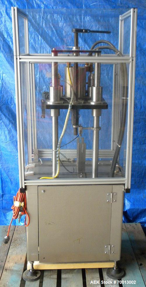 Used JG Machine Works Air Operated Inline Aerosol Crimper. Capable of 10 to 15 per minute. Capacity for 1" can valve and for vials/bottles all mm sizes. Crimps cans, glass bottles, and vials. Include...