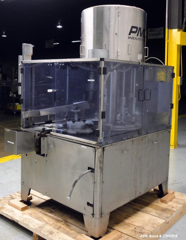 Used PMC Model XRI-8000 Rotary Pump Crimper. Capable of speeds up to 120 per minute. Minimum height of container in puck 4-1/2" and maximum height of container in puck 6-1/2". 8 heads now tooled for ...