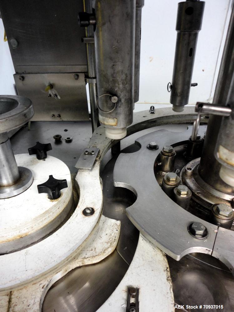 Used PMC Model XRI-8000 Rotary Pump Crimper. Capable of speeds up to 120 per minute. Minimum height of container in puck 4-1/2" and maximum height of container in puck 6-1/2". 8 heads now tooled for ...