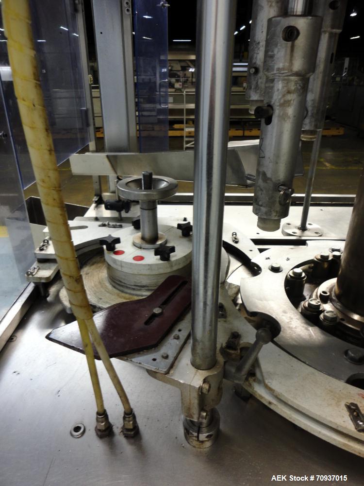 Used PMC Model XRI-8000 Rotary Pump Crimper. Capable of speeds up to 120 per minute. Minimum height of container in puck 4-1/2" and maximum height of container in puck 6-1/2". 8 heads now tooled for ...