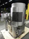 Used Nalbach Model 8 H.V.C. 8-Head Rotary Cap Crimper. Machine is capable of speeds up to 240 caps per minute. Is an 8-head crimper currently set on 25mm caps. Has worm screw to star wheel infeed. Ro...