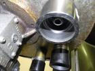 Used Nalbach Model 8 H.V.C. 8-Head Rotary Cap Crimper. Machine is capable of speeds up to 240 caps per minute. Is an 8-head crimper currently set on 25mm caps. Has worm screw to star wheel infeed. Ro...
