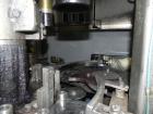 Used Nalbach Model 8 H.V.C. 8-Head Rotary Cap Crimper. Machine is capable of speeds up to 240 caps per minute. Is an 8-head crimper currently set on 25mm caps. Has worm screw to star wheel infeed. Ro...
