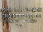 Used Nalbach Model 8 H.V.C. 8-Head Rotary Cap Crimper. Machine is capable of speeds up to 240 caps per minute. Is an 8-head crimper currently set on 25mm caps. Has worm screw to star wheel infeed. Ro...