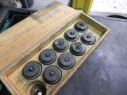 Used Nalbach Model 8 H.V.C. 8-Head Rotary Cap Crimper. Machine is capable of speeds up to 240 caps per minute. Is an 8-head crimper currently set on 25mm caps. Has worm screw to star wheel infeed. Ro...