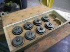 Used Nalbach Model 8 H.V.C. 8-Head Rotary Cap Crimper. Machine is capable of speeds up to 240 caps per minute. Is an 8-head crimper currently set on 25mm caps. Has worm screw to star wheel infeed. Ro...