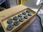 Used Nalbach Model 8 H.V.C. 8-Head Rotary Cap Crimper. Machine is capable of speeds up to 240 caps per minute. Is an 8-head crimper currently set on 25mm caps. Has worm screw to star wheel infeed. Ro...