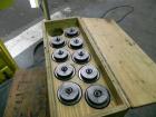 Used Nalbach Model 8 H.V.C. 8-Head Rotary Cap Crimper. Machine is capable of speeds up to 240 caps per minute. Is an 8-head crimper currently set on 25mm caps. Has worm screw to star wheel infeed. Ro...