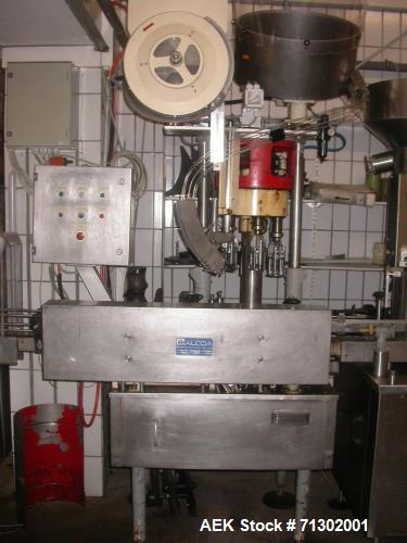 Used Alcoa 4 Head Capper. Used for MCA 28 and Stelvin 30/60 caps. Has change parts for 31.5 mm. Last used on wine bottles. 3/50/380v