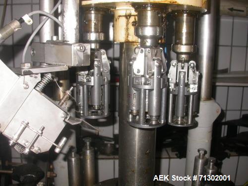 Used Alcoa 4 Head Capper. Used for MCA 28 and Stelvin 30/60 caps. Has change parts for 31.5 mm. Last used on wine bottles. 3/50/380v