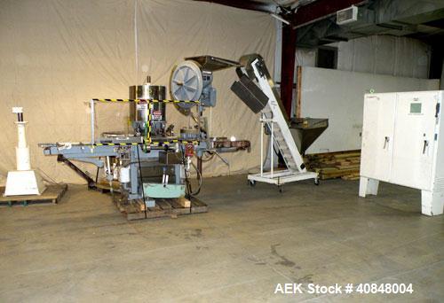 Used Consolidated TG-6-15 Rotary Chuck Capper. Capable of speeds up to 75-150 cpm. Currently set up for 24mm caps. Includes (1) Consolidated vertical sorter, model F30, driven by a 3/4 hp, 3/60/208-2...