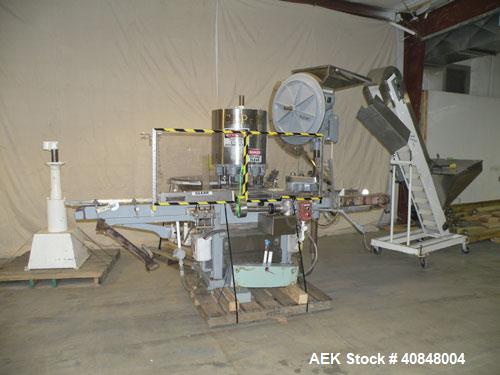 Used Consolidated TG-6-15 Rotary Chuck Capper. Capable of speeds up to 75-150 cpm. Currently set up for 24mm caps. Includes (1) Consolidated vertical sorter, model F30, driven by a 3/4 hp, 3/60/208-2...