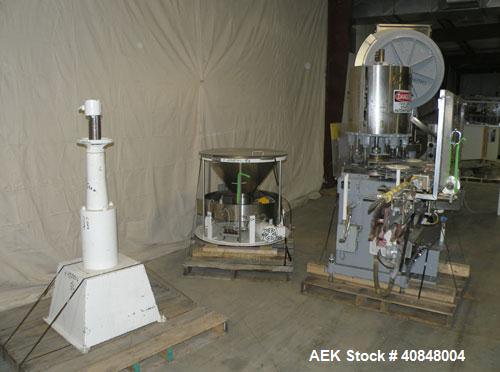 Used Consolidated TG-6-15 Rotary Chuck Capper. Capable of speeds up to 75-150 cpm. Currently set up for 24mm caps. Includes (1) Consolidated vertical sorter, model F30, driven by a 3/4 hp, 3/60/208-2...