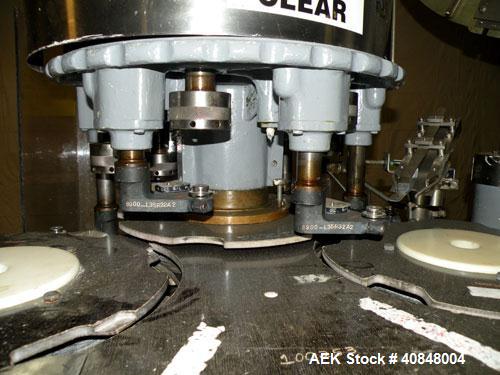 Used Consolidated TG-6-15 Rotary Chuck Capper. Capable of speeds up to 75-150 cpm. Currently set up for 24mm caps. Includes (1) Consolidated vertical sorter, model F30, driven by a 3/4 hp, 3/60/208-2...