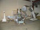 Used Consolidated TG-6-15 Rotary Chuck Capper. Capable of speeds up to 75-150 cpm. Currently set up for 24mm caps. Includes (1) Consolidated vertical sorter, model F30, driven by a 3/4 hp, 3/60/208-2...