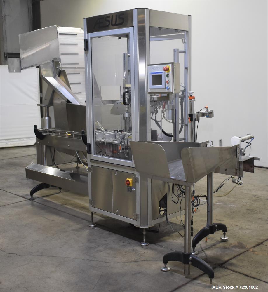 Used- Aesus Model Delta Chuckcap Automatic Single Chuck Capper. Capable of speeds up to 60 containers per minute. Has interm...