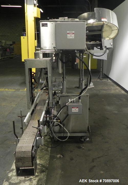 Used Anderson Machine Systems Model C1101 Single Head Chuck Capper. Machine is rated at up to 60 bottles per minute.  Machine has integrated cap sorter with cap chute.  Has air rinsing station.  Stai...