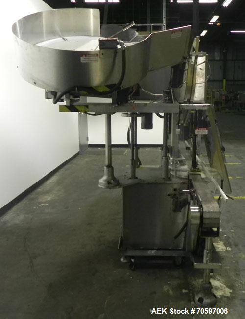 Used Anderson Machine Systems Model C1101 Single Head Chuck Capper. Machine is rated at up to 60 bottles per minute.  Machine has integrated cap sorter with cap chute.  Has air rinsing station.  Stai...