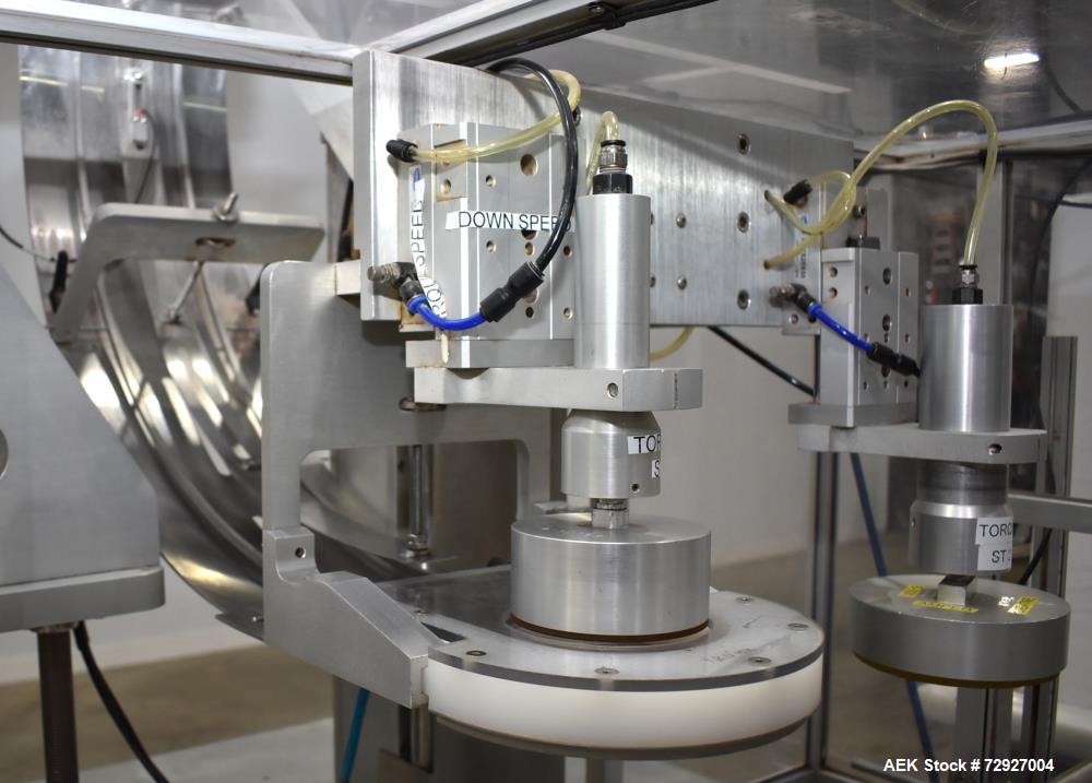 Used Balpack Automatic 2-Station Chuck Capper, Model CEIB. Fully Automatic 2 station inline chuck capper. Capable of speeds up to 55 BPM. Large format cap size range: 45mm-120mm (dia) with changepart...