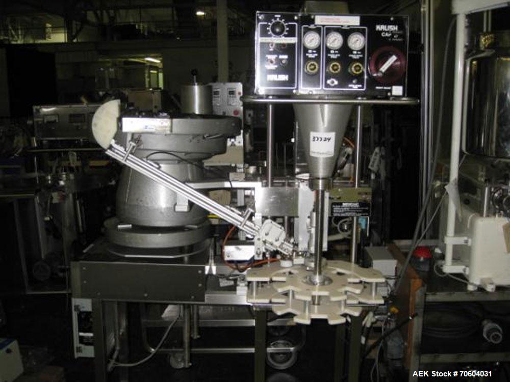 Used Kalish Starcap Automatic Chuck Capper. Capable of speeds up to 80 bottles per minute. Cap size range: 13mm to 58mm with changeparts. Currently set up on 43mm diam caps. Has a vibratory bowl feed...