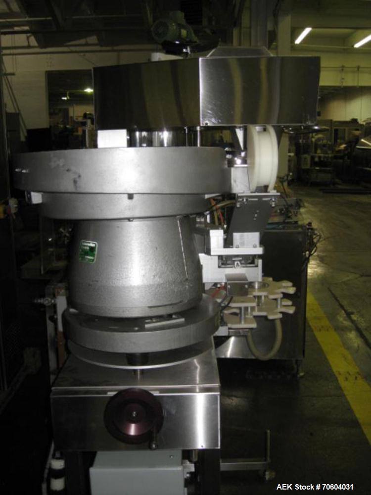 Used Kalish Starcap Automatic Chuck Capper. Capable of speeds up to 80 bottles per minute. Cap size range: 13mm to 58mm with changeparts. Currently set up on 43mm diam caps. Has a vibratory bowl feed...